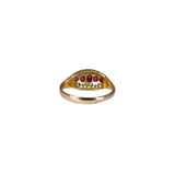 Gold ring with embedded red gemstones on a white background