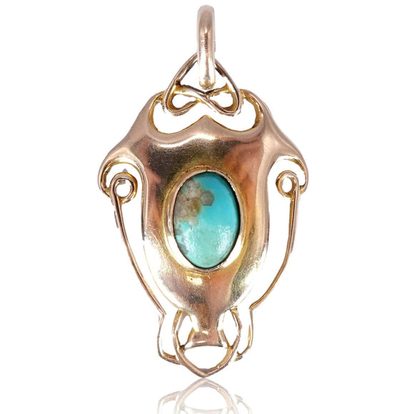 Gold pendant with a turquoise stone on a white background