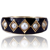 Ring with black band and gold accents on a white background