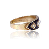 Gold ring with a pearl on a white background
