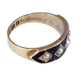 Gold ring with pearls and blue enamel on a white background