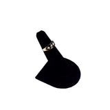 Black jewelry stand with gold ring
