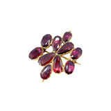 Red Gemstone brooch on white background
