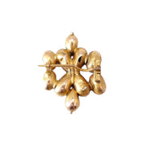 Gold brooch with a floral design on a white background