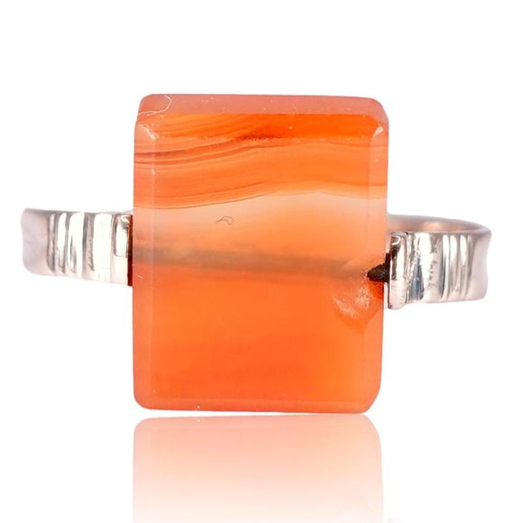 Orange square ring with rose gold band on a white background