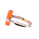 Ring with a silver band and orange square accent on a white background