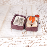 Vintage ring in a purple box on an old letter