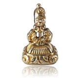 Gold bell-shaped pendant on a white background