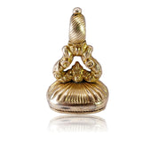 Gold pendant on a white background