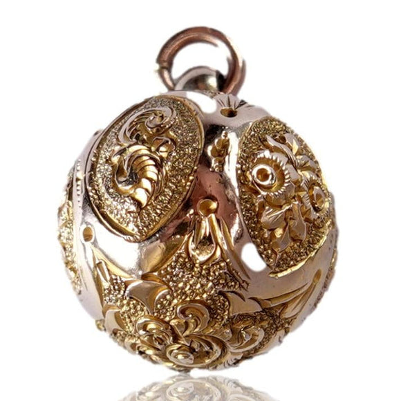 Gold pendant on a white background