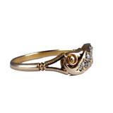 Gold ring with a diamond on a white background