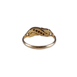 Gold ring with a unique design on a white background