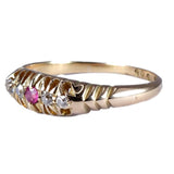Gold ring with a pink gemstone on a white background