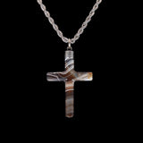 Cross pendant necklace with a black background