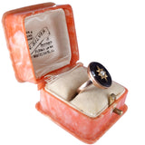 Open jewelry box with a ring inside on a white background