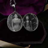 Double-sided locket with vintage portraits on a dark background