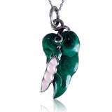 Green pendant with silver chain on a white background