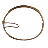 Bronze hoop with a string on a white background