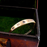 Gold bracelet with star-shaped stones in a jewelry box