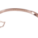 Rose gold bracelet on a white background