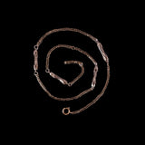 Bronze chain necklace on a black background