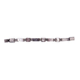 Metallic belt with multiple straps on a white background