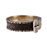 Bracelet with brown leather strap and silver buckle on a white background
