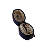 Open jewelry box with a ring inside on a white background