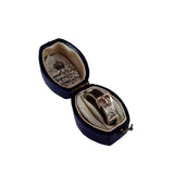 Vintage ring in an open jewelry box with a white background