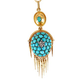 Gold necklace with a turquoise pendant on a white background