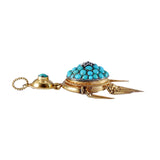 Vintage-style gold pendant with turquoise stones on a white background