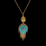 Gold necklace with a turquoise pendant on a black background