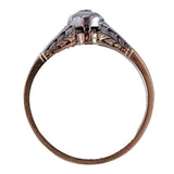 Rose gold ring with a diamond on a white background