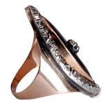 Rose gold ring with diamonds on a white background