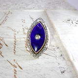 Blue gemstone hair clip on a textured white background