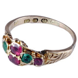 Silver ring with colorful gemstones on a white background