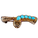 Gold brooch with turquoise stones on a white background