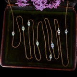 Edwardian 18k Gold Opal and Rock Crystal Long Chain circa 1910