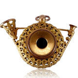 Decorative gold pendant on a white background