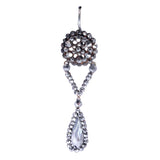 Earring with beaded design and teardrop-shaped gem on a white background