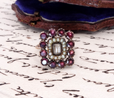 Vintage ring with gemstones on a piece of paper