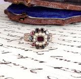 Decorative ring with gemstones on a piece of paper with writing