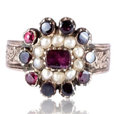 Decorative ring with gemstones on a white background