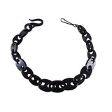 A black chain-link collar necklace with a unique interlocking link design, shown on a plain white background.
