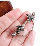 Victorian Silver, Cat's Eye Chrysoberyl, Garnet and Seed Pearl Fly Brooch circa 1870